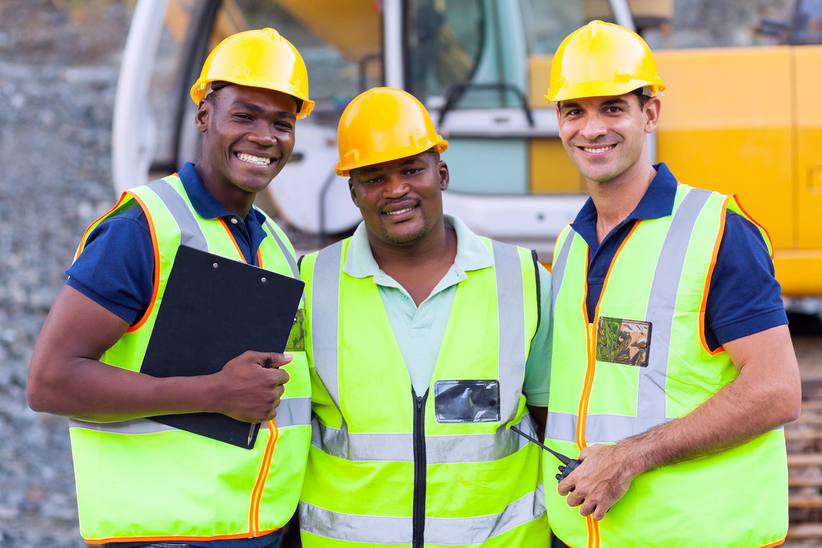 Construction workers on site in high visibility clothing